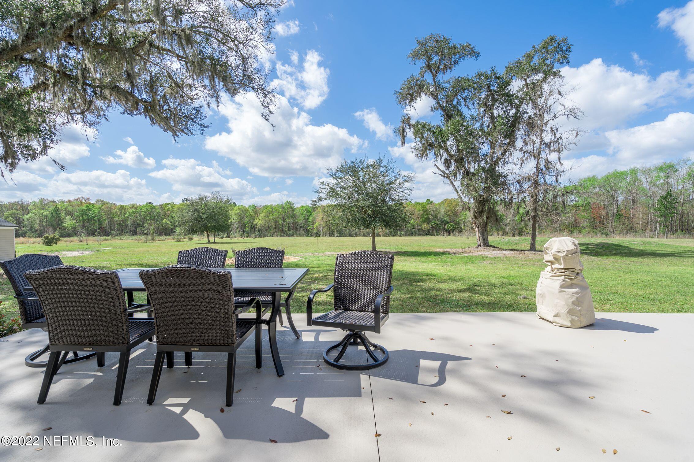 54476 Wildlife Way Callahan, FL 32011 - Photo 29 of 35 a view of a patio with chairs and a table