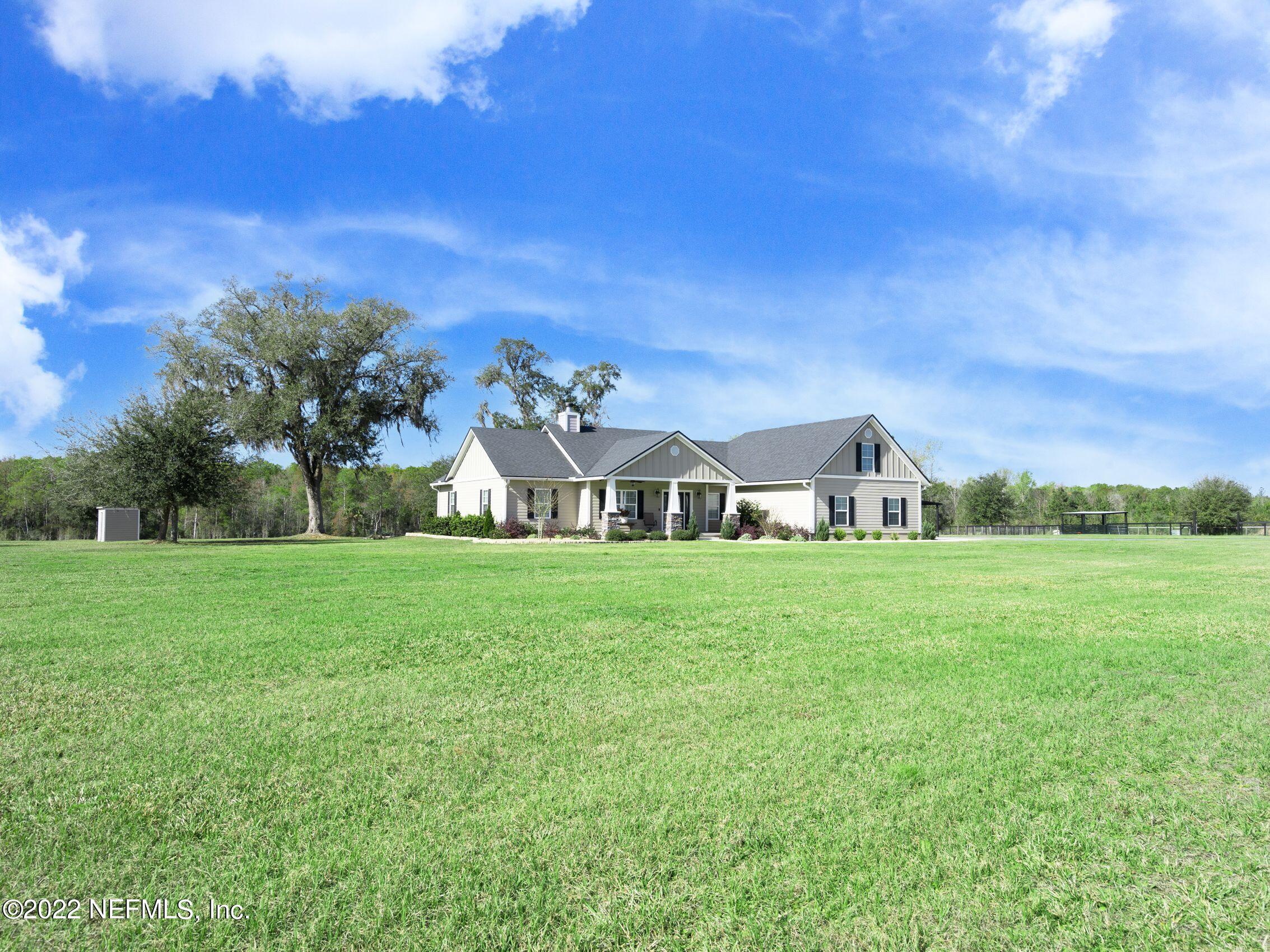 54476 Wildlife Way Callahan, FL 32011 - Photo 3 of 35 a front view of a house with garden