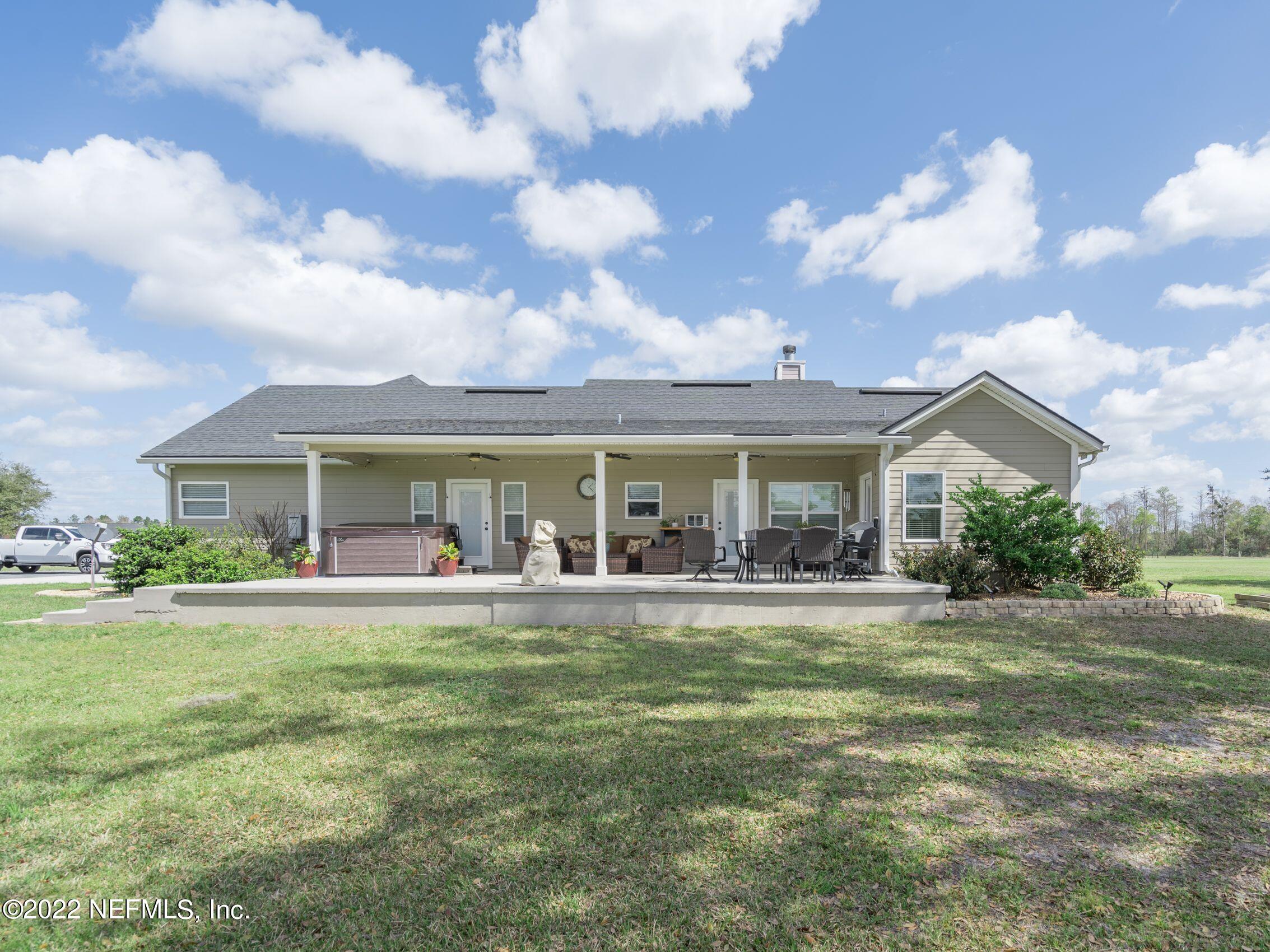 54476 Wildlife Way Callahan, FL 32011 - Photo 31 of 35 a front view of house with yard outdoor seating and barbeque oven