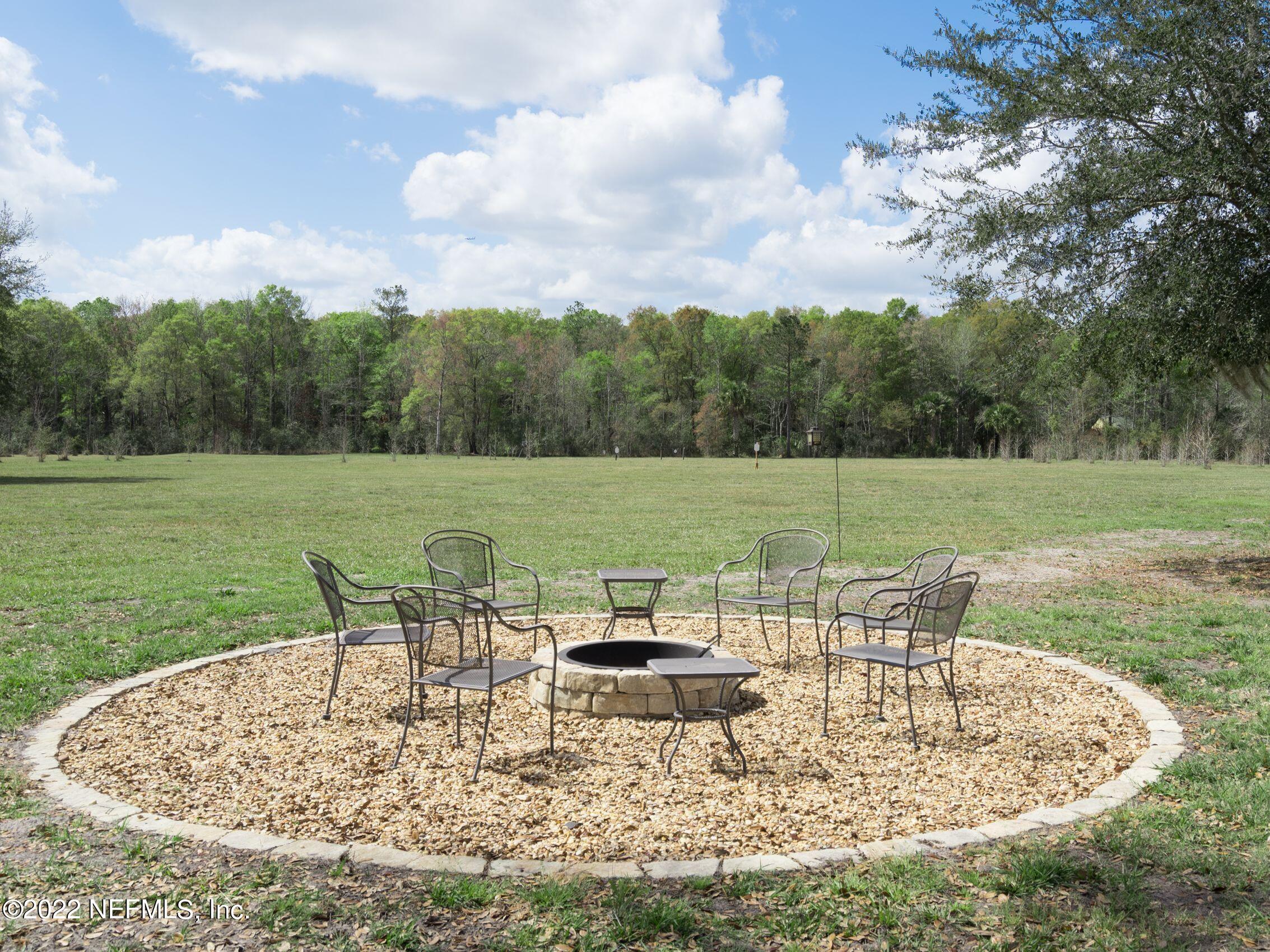 54476 Wildlife Way Callahan, FL 32011 - Photo 33 of 35 a view of a swimming pool and lounge chairs