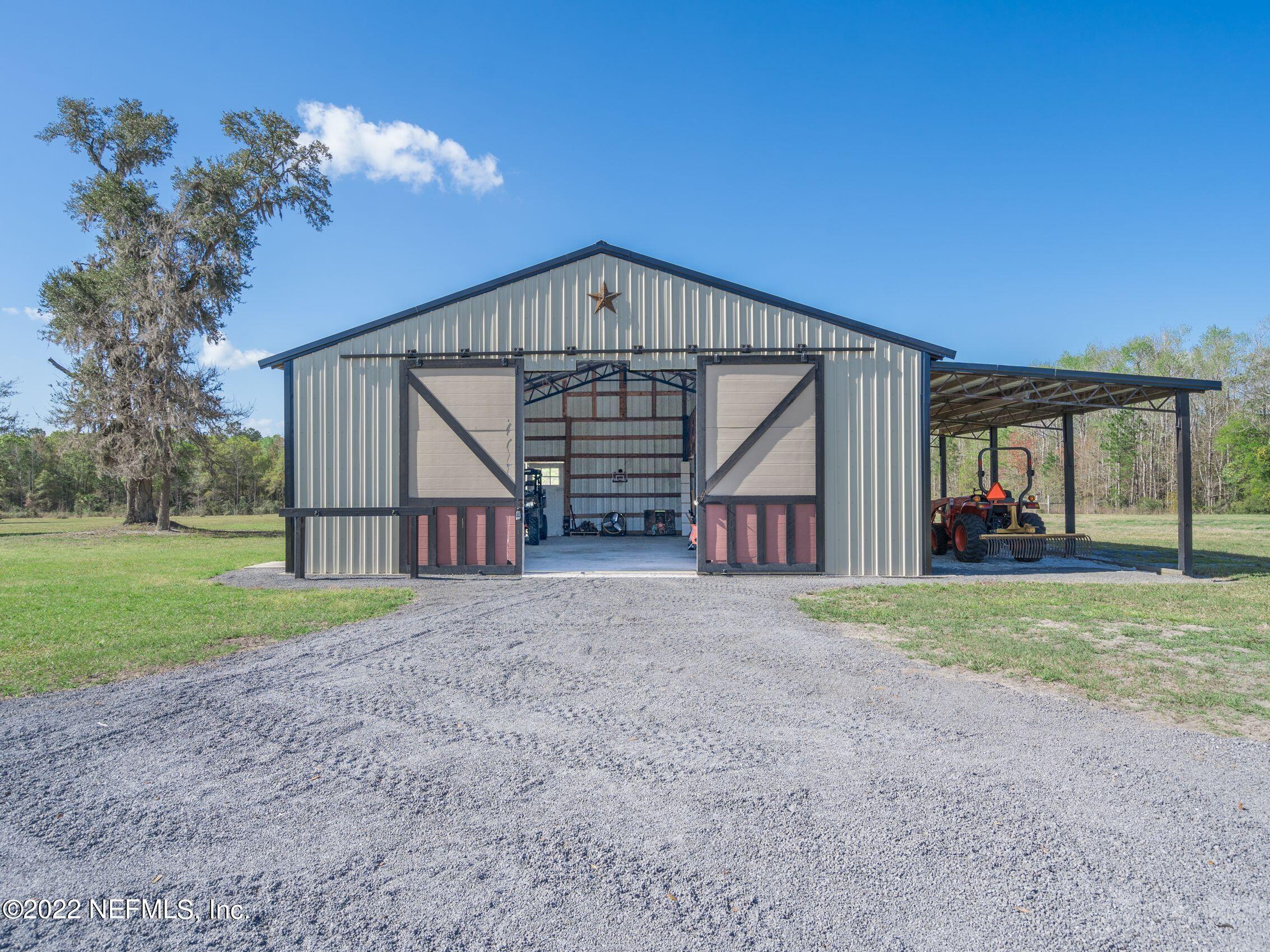 54476 Wildlife Way Callahan, FL 32011 - Photo 5 of 35 a view of backyard of house and deck