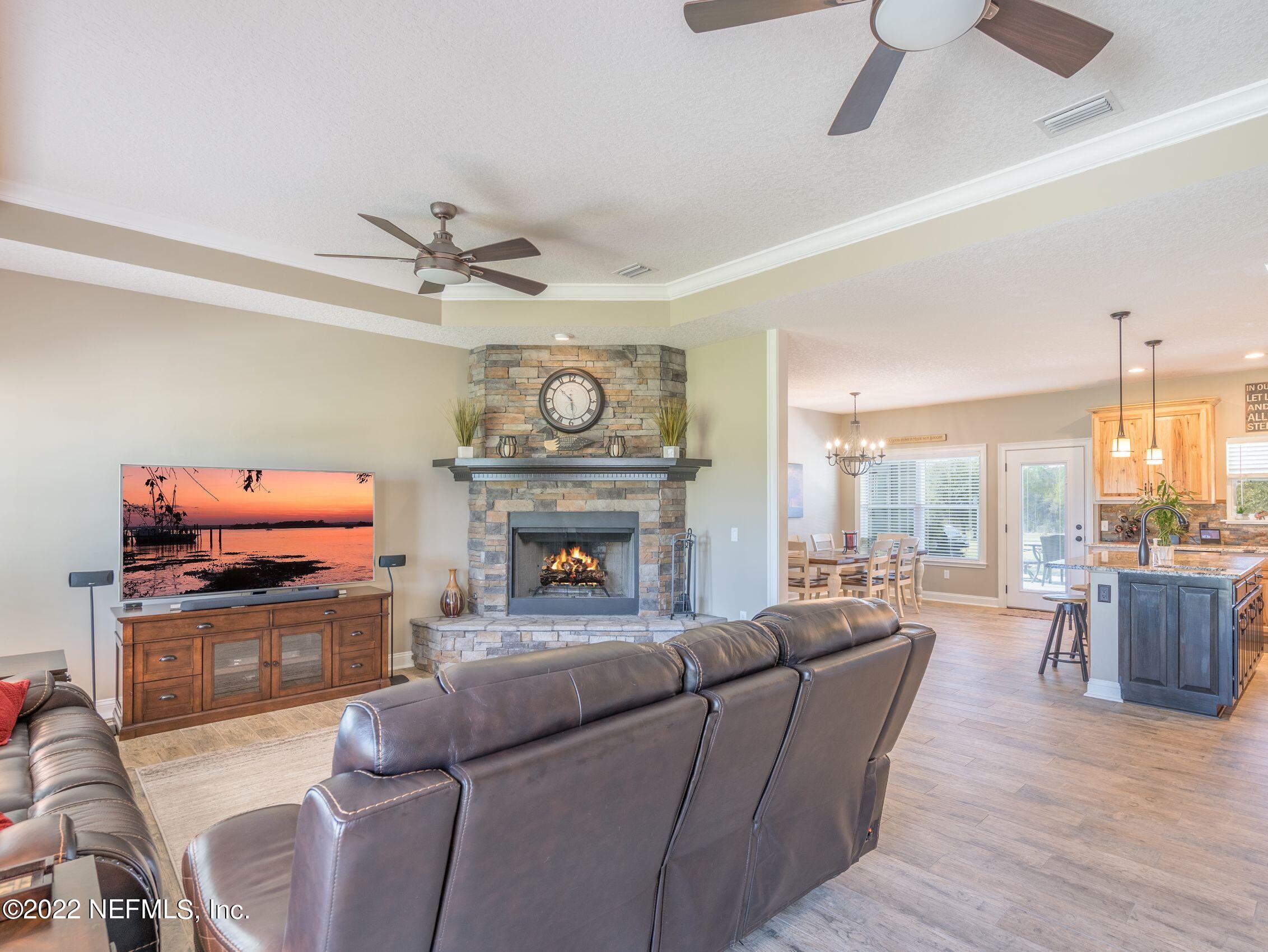 54476 Wildlife Way Callahan, FL 32011 - Photo 8 of 35 a living room with furniture and a fireplace