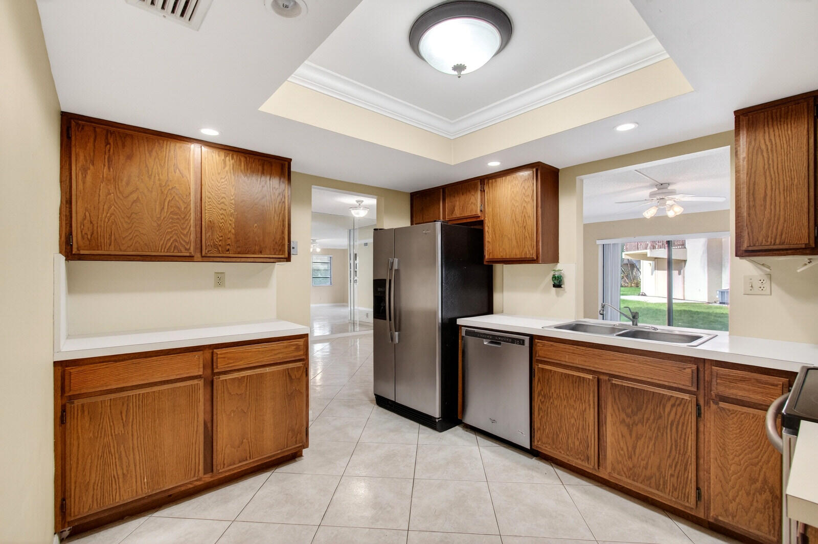 3951 Northeast 19th Road, Unit 1701 Pompano Beach, FL 33064 - Photo 36 of 82 a kitchen with stainless steel appliances granite countertop a sink and cabinets