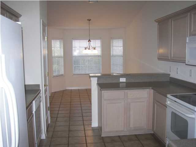 139 Shipwreck Road Santa Rosa Beach, FL 32459 - Photo 3 of 28 a kitchen with a sink and cabinets