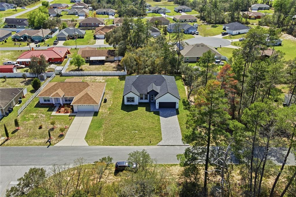 2600 Southwest 146th Pl Road Ocala, FL 34473 - Photo 5 of 40 an aerial view of a house with yard swimming pool and outdoor seating