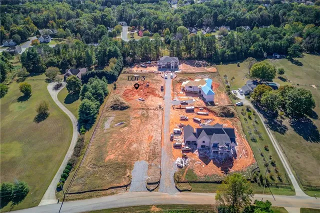 an aerial view of a house with a garden