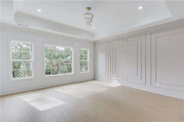 a bathroom with a double vanity sink and mirror with shower