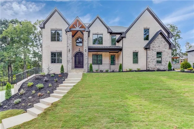a front view of house with yard and green space