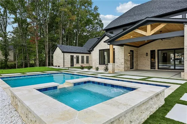 a view of a swimming pool with a yard