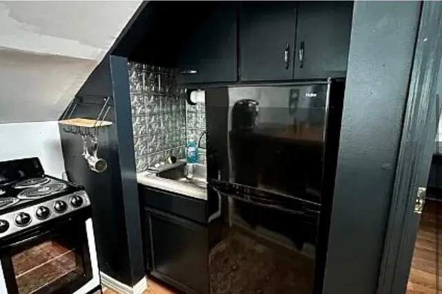 a bedroom with a bed and a mirror