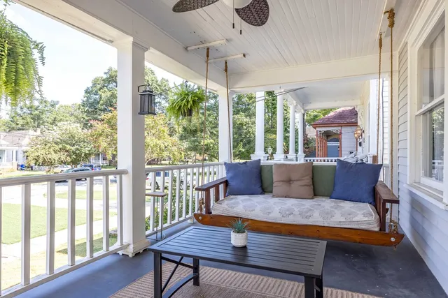 a view of a porch with a floor to ceiling window