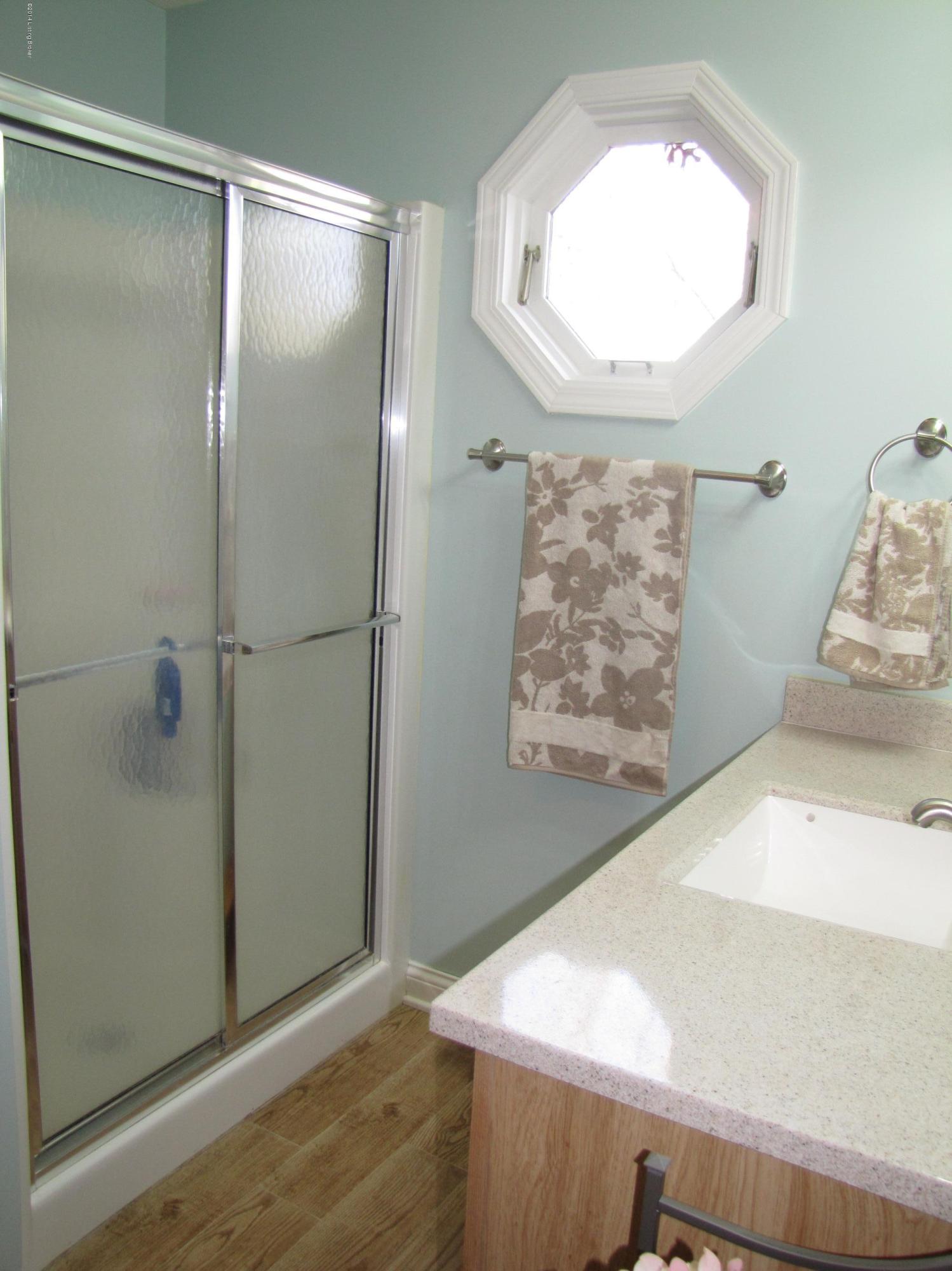 218 Fox Run Road Pendleton, KY 40055 - Photo 20 of 54 The attached master bathroom has a coastal feel with breezy colors and gorgeous hickory cabinetry.