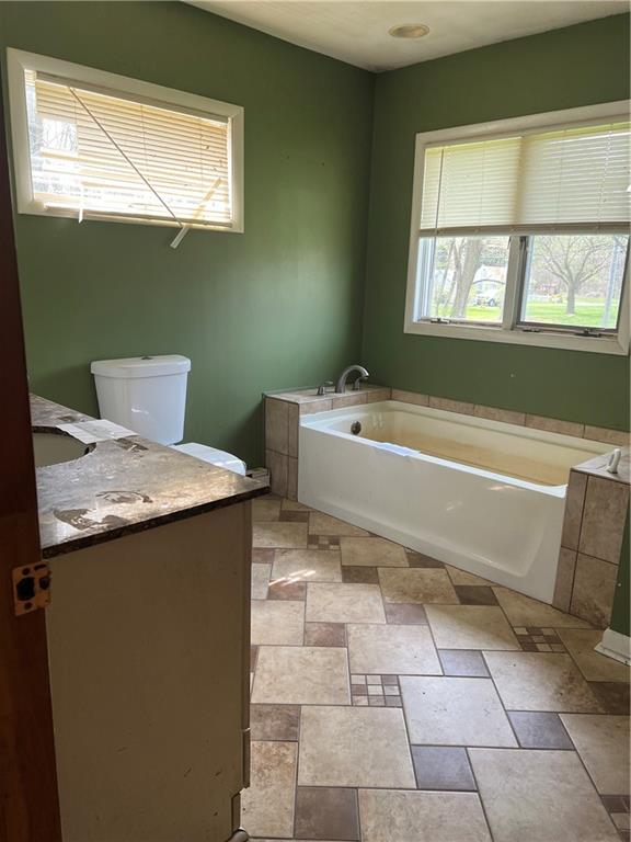 88 Fleming Road Grove City, PA 16127 - Photo 12 of 19 a bath room with a sink and a bath tub