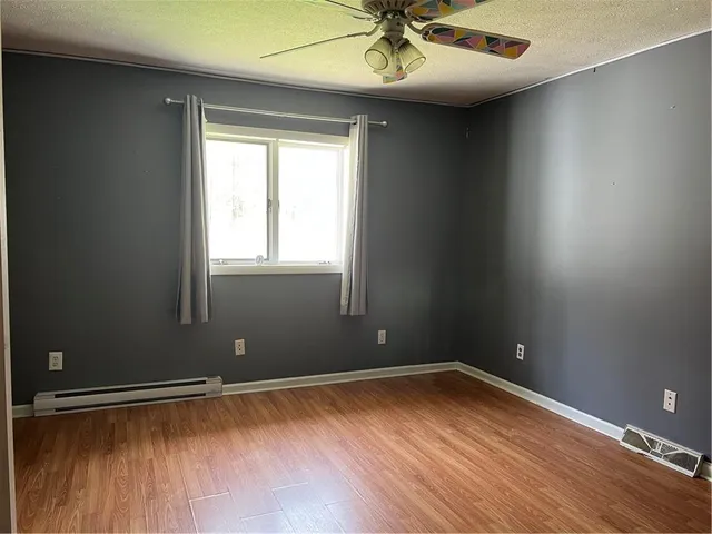 wooden floor and window in an empty room
