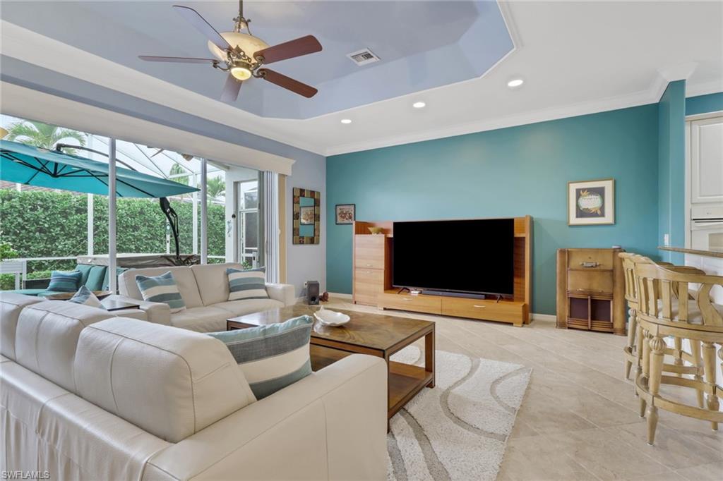 9348 Sun River Way Estero, FL 33928 - Photo 11 of 38 a living room with furniture and a flat screen tv