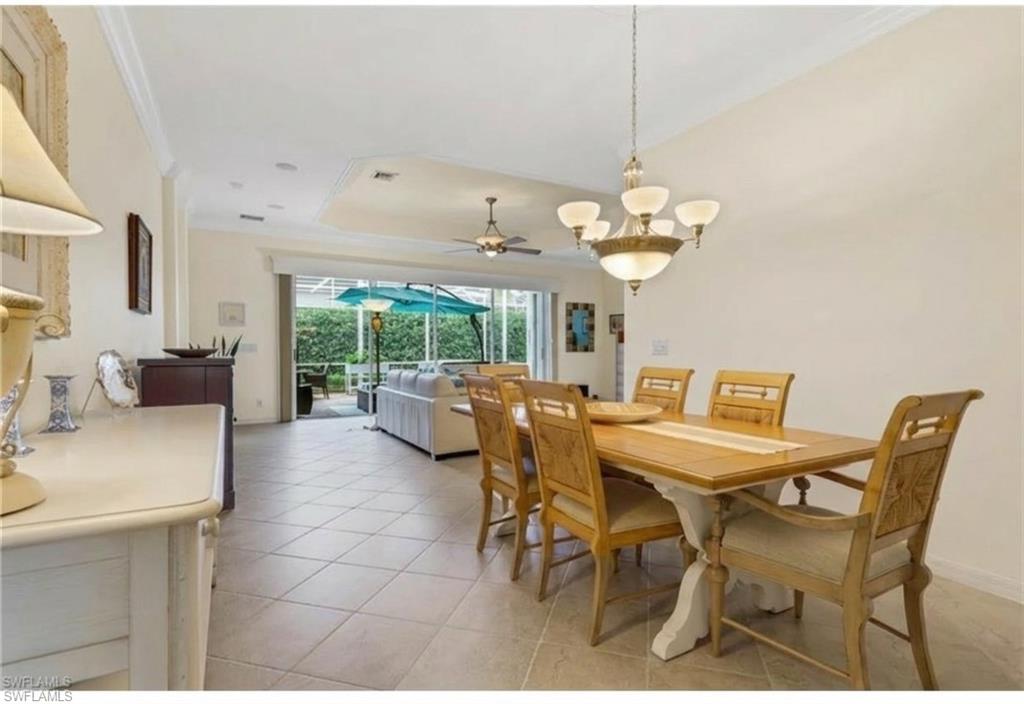 9348 Sun River Way Estero, FL 33928 - Photo 14 of 50 Dining space featuring ornamental molding, a sunroom, ceiling fan, and light tile patterned floors