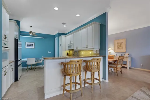 a kitchen with a table and chairs in it