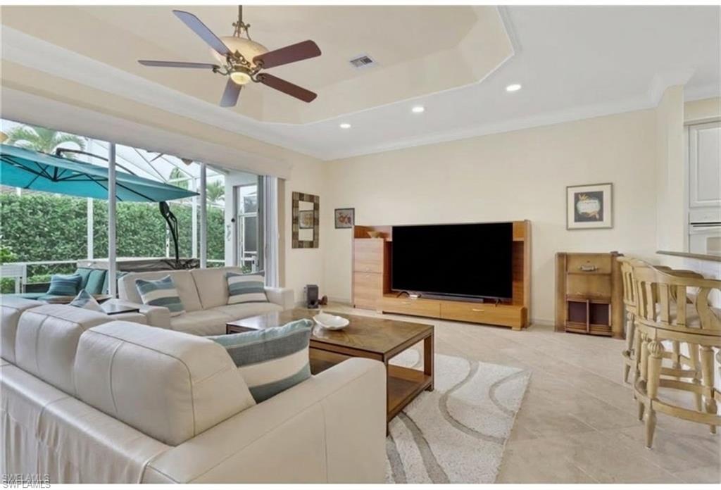 9348 Sun River Way Estero, FL 33928 - Photo 16 of 50 Living area featuring a sunroom, crown molding, a ceiling fan, and recessed lighting