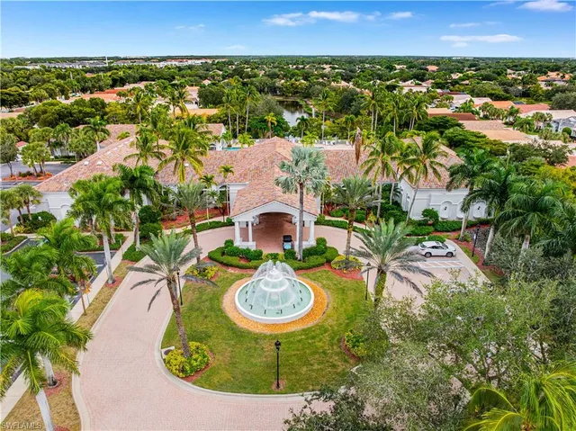 an aerial view of residential houses with outdoor space and swimming pool