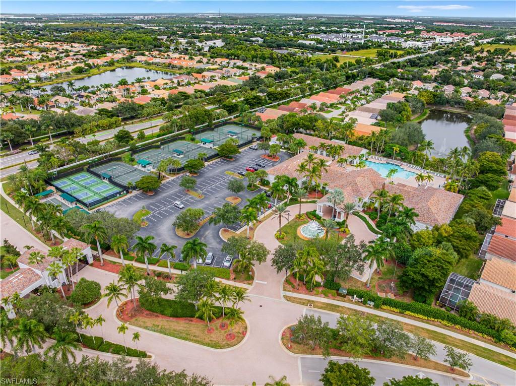 9348 Sun River Way Estero, FL 33928 - Photo 30 of 38 an aerial view of residential houses with outdoor space