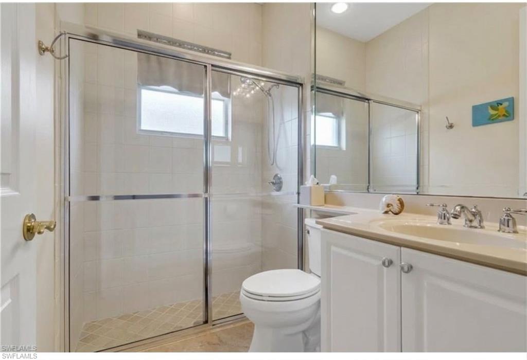 9348 Sun River Way Estero, FL 33928 - Photo 33 of 50 Full bath featuring vanity and a shower stall