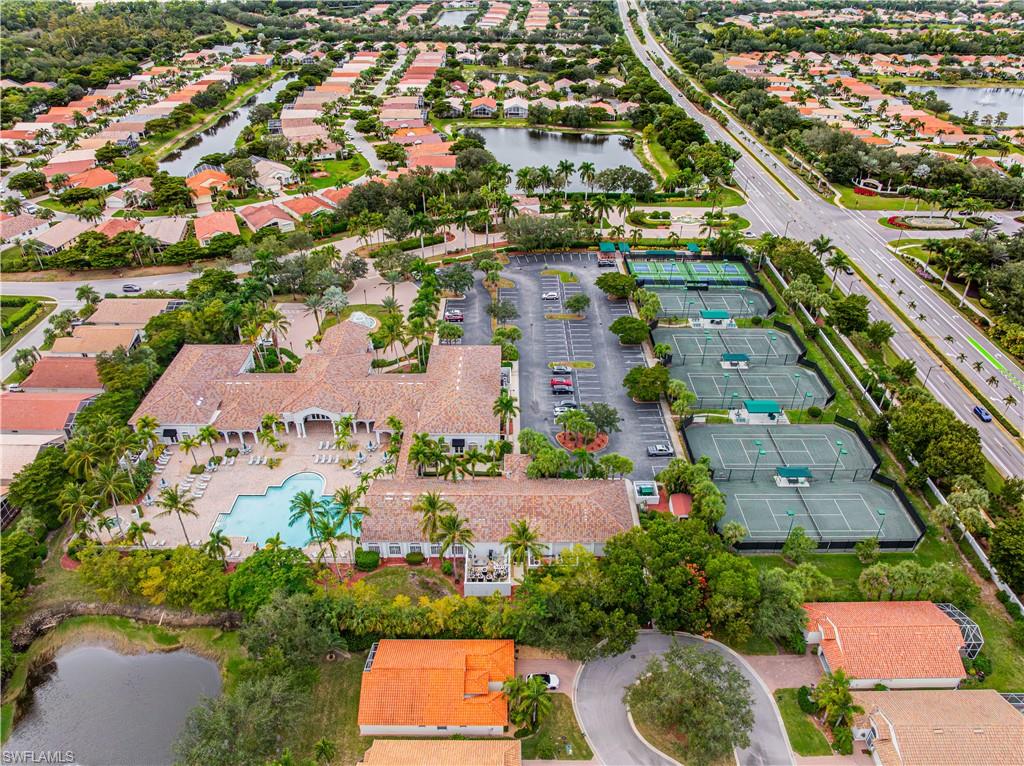 9348 Sun River Way Estero, FL 33928 - Photo 38 of 50 Aerial view of property's location with a large body of water and nearby suburban area