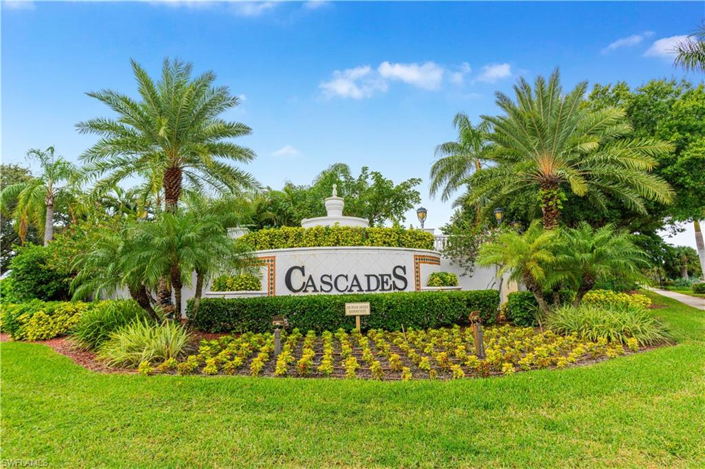 9348 Sun River Way Estero, FL 33928 - Photo 47 of 50 Community sign with a yard