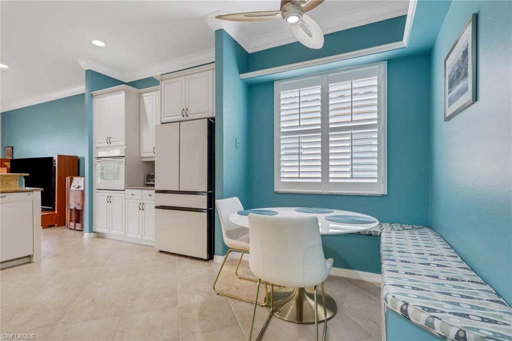 9348 Sun River Way Estero, FL 33928 - Photo 7 of 50 Kitchen with white appliances, white cabinets, crown molding, a ceiling fan, and recessed lighting