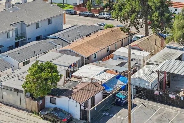 an aerial view of residential houses with outdoor space