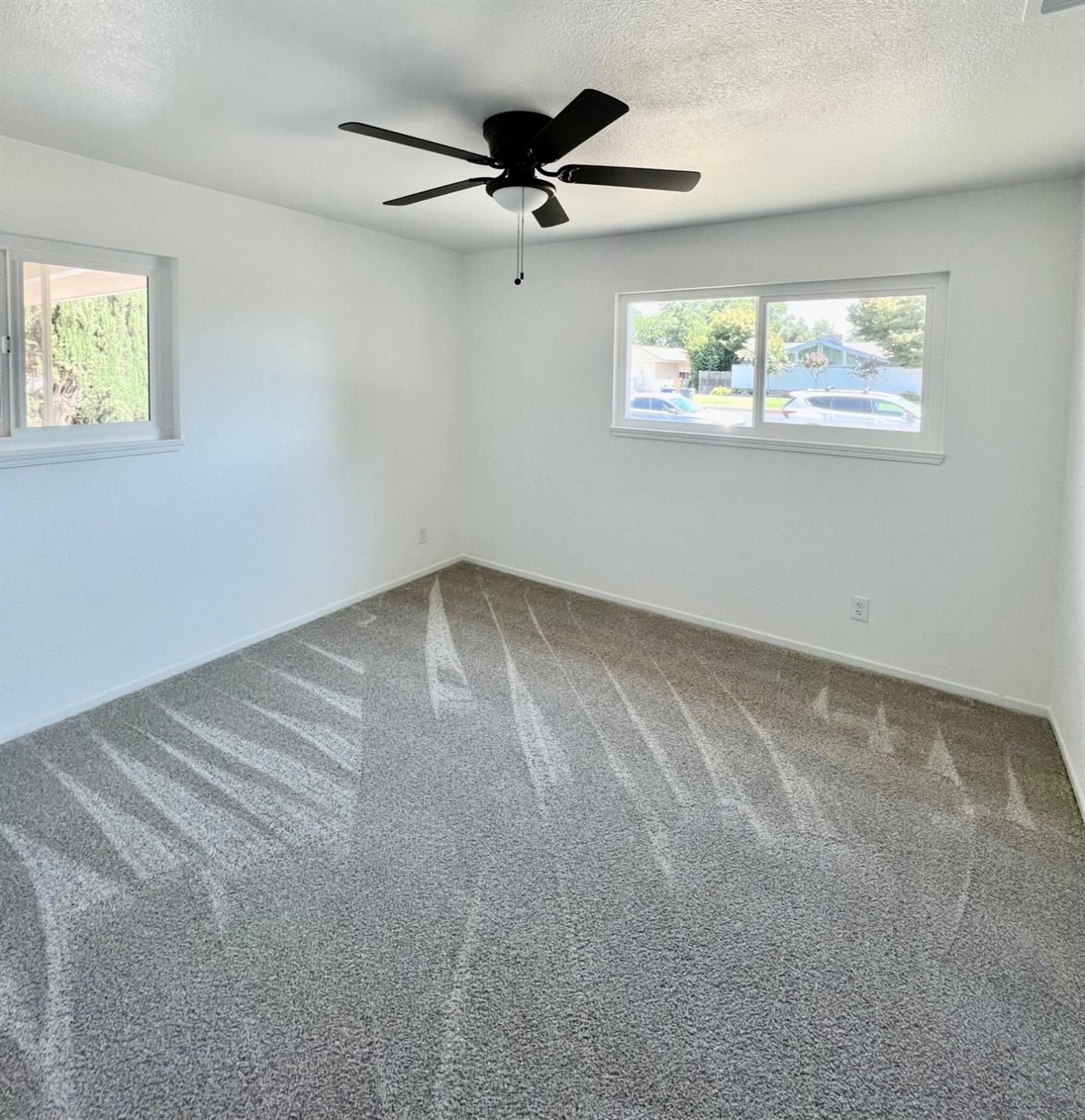 1237 De Cesari Avenue Madera, CA 93637 - Photo 13 of 24 a view of an empty room with a window