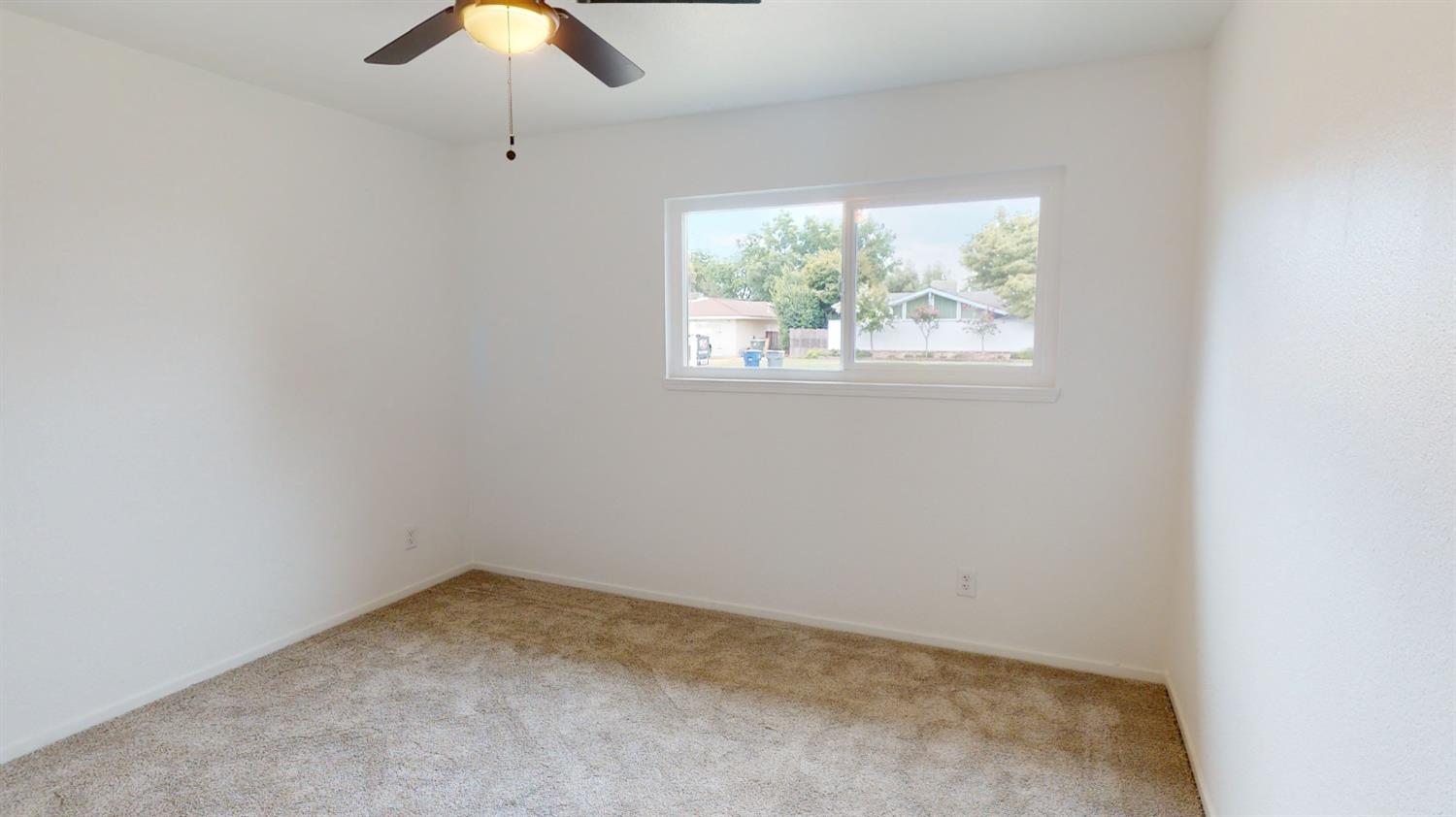 1237 De Cesari Avenue Madera, CA 93637 - Photo 14 of 24 an empty room with a window