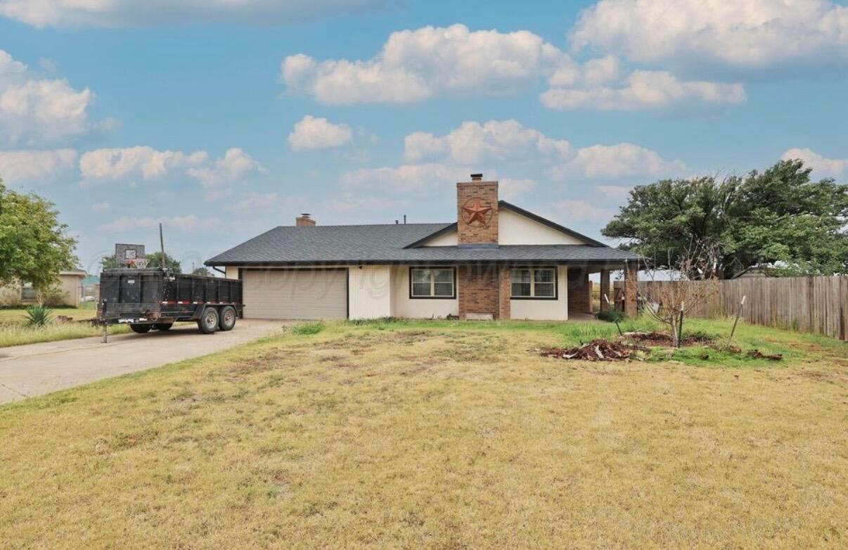 225 Bordeaux Lane Amarillo, TX 79119 - Photo 1 of 25 a front view of a house with a yard