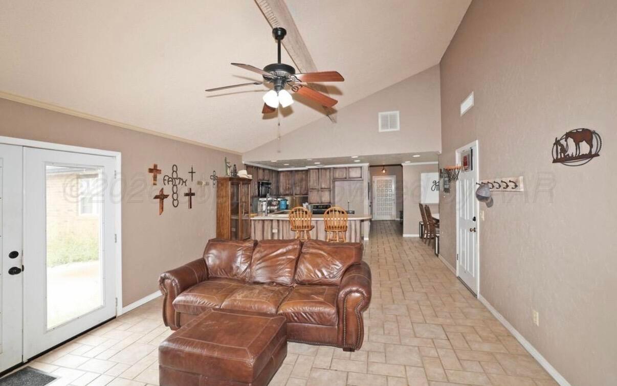 225 Bordeaux Lane Amarillo, TX 79119 - Photo 12 of 25 a living room with furniture and a large window