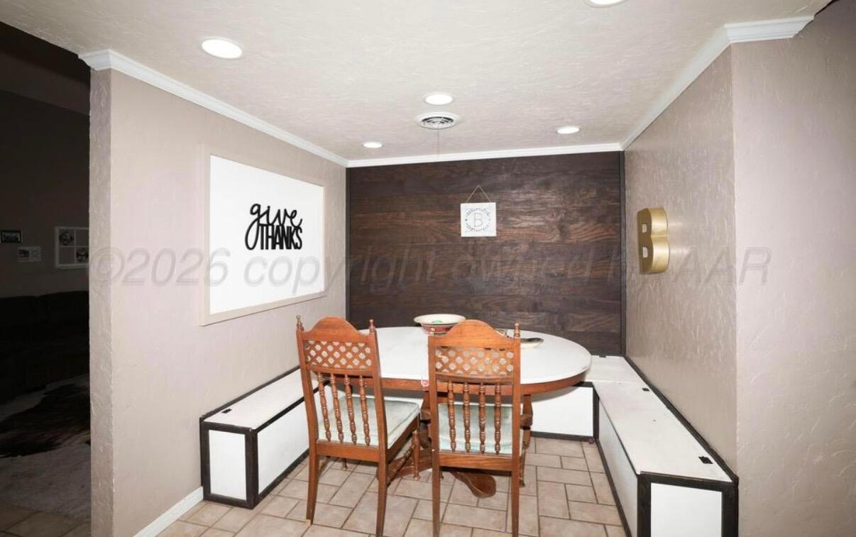 225 Bordeaux Lane Amarillo, TX 79119 - Photo 8 of 25 a view of a dining room with furniture and wooden floor