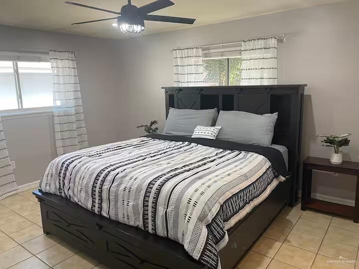 5100 North 16th Street McAllen, TX 78504 - Photo 4 of 14 a large bed sitting in a bedroom next to a window