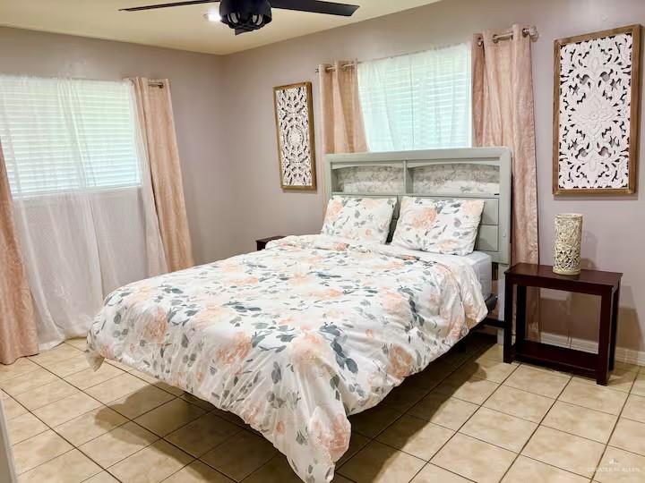 5100 North 16th Street McAllen, TX 78504 - Photo 7 of 14 a bedroom with a bed and a window