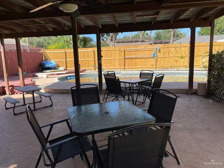 5100 North 16th Street McAllen, TX 78504 - Photo 8 of 14 a view of a dining room with furniture window and outside view