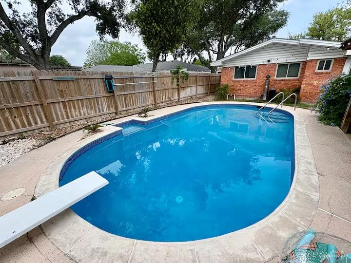 5100 North 16th Street McAllen, TX 78504 - Photo 10 of 14 a view of a white house with a swimming pool