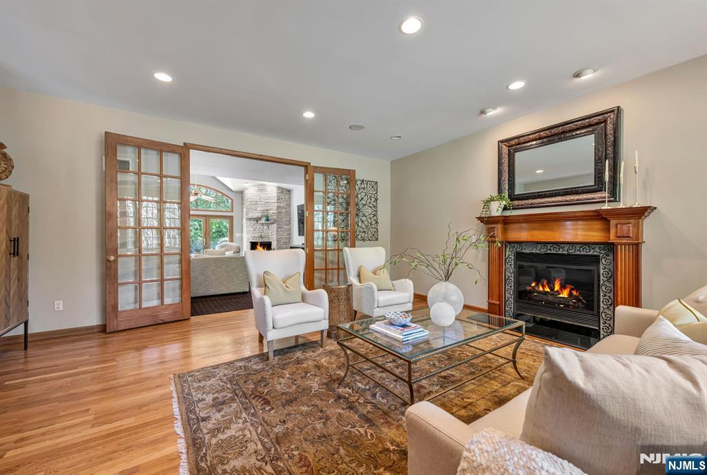411 Snyder Road Wyckoff, NJ 07481 - Photo 5 of 36 a living room with furniture and a fireplace