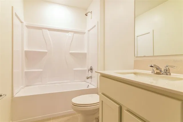 a bathroom with a sink a toilet and a bathtub