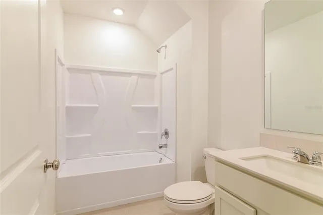 a bathroom with a toilet a sink and a bathtub