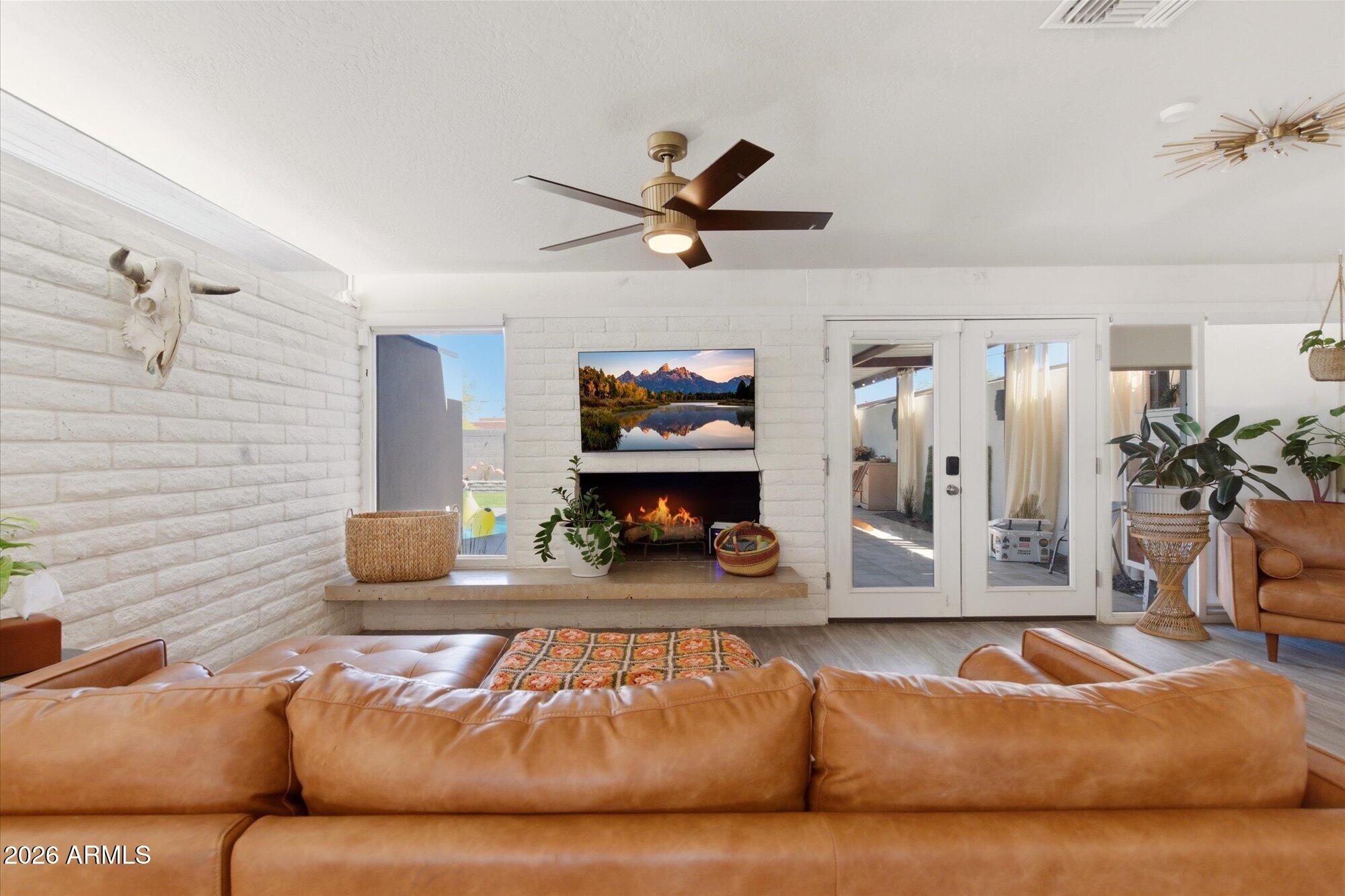 3020 East Wethersfield Road Phoenix, AZ 85032 - Photo 1 of 46 a living room with furniture and a fireplace