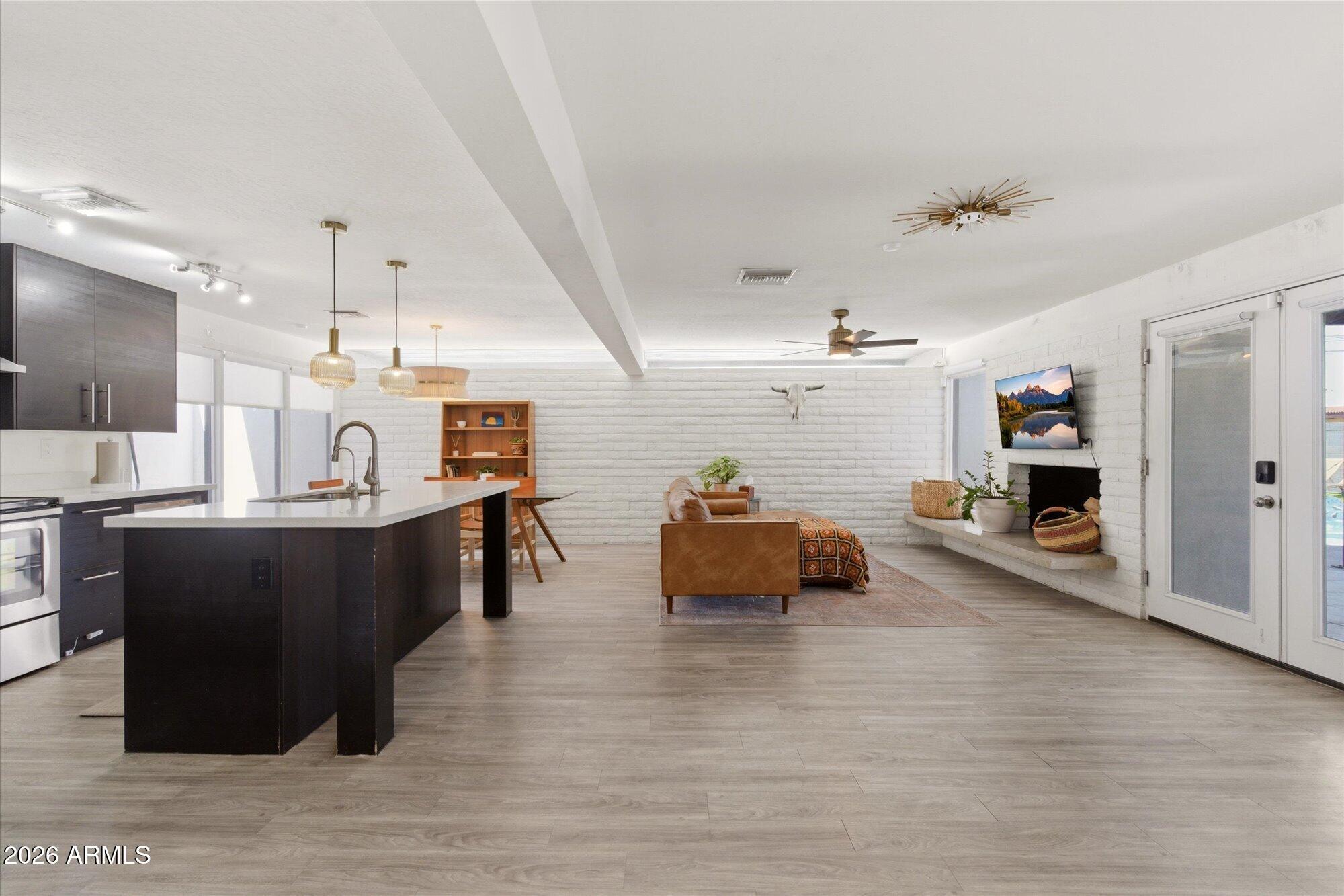 3020 East Wethersfield Road Phoenix, AZ 85032 - Photo 14 of 46 a living room with furniture and a wooden floor