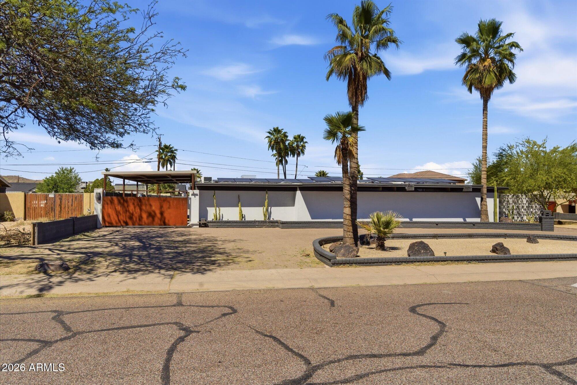 3020 East Wethersfield Road Phoenix, AZ 85032 - Photo 16 of 46 a view of a street with house
