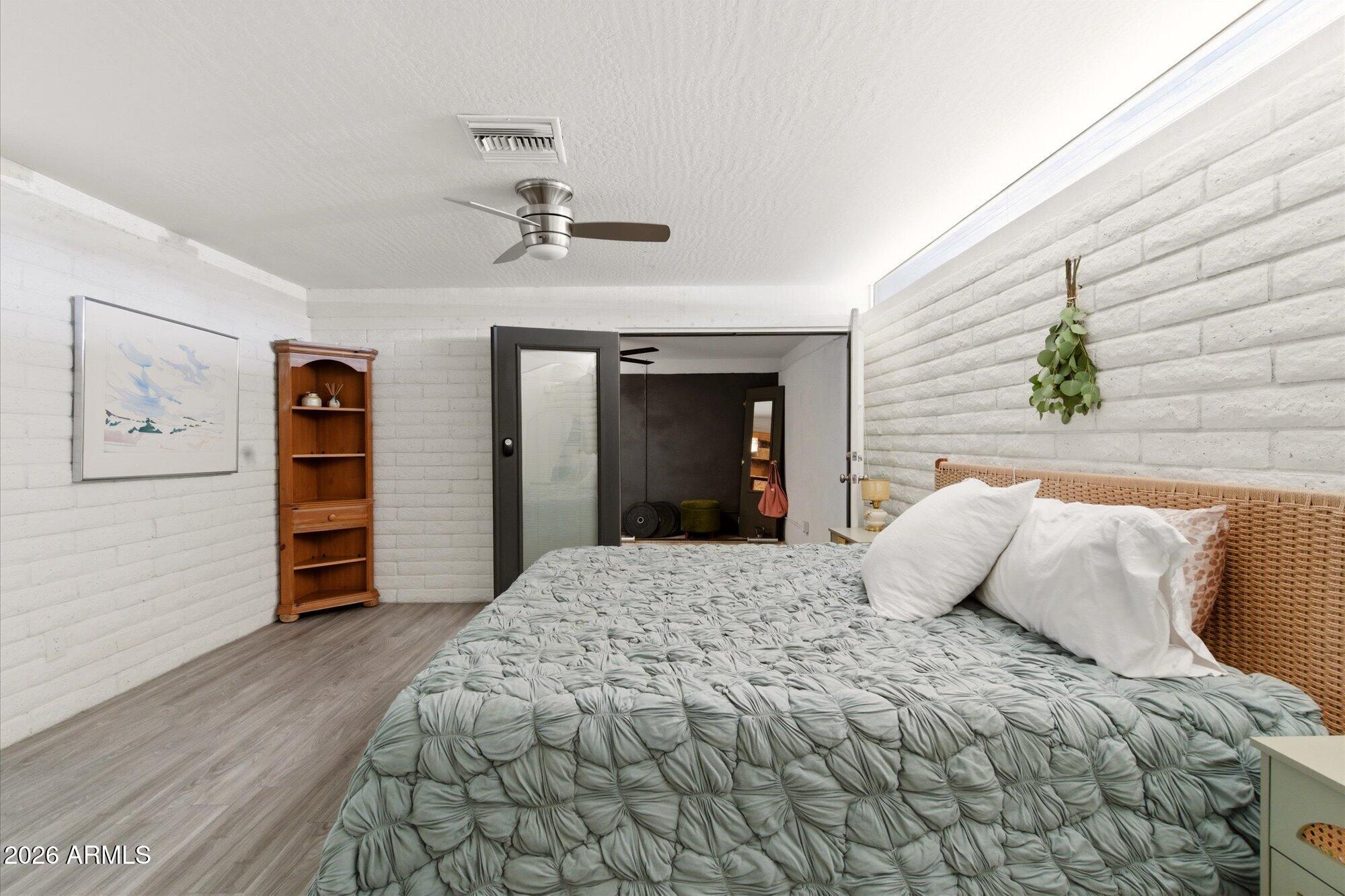 3020 East Wethersfield Road Phoenix, AZ 85032 - Photo 18 of 46 a bedroom with a bed and a dresser