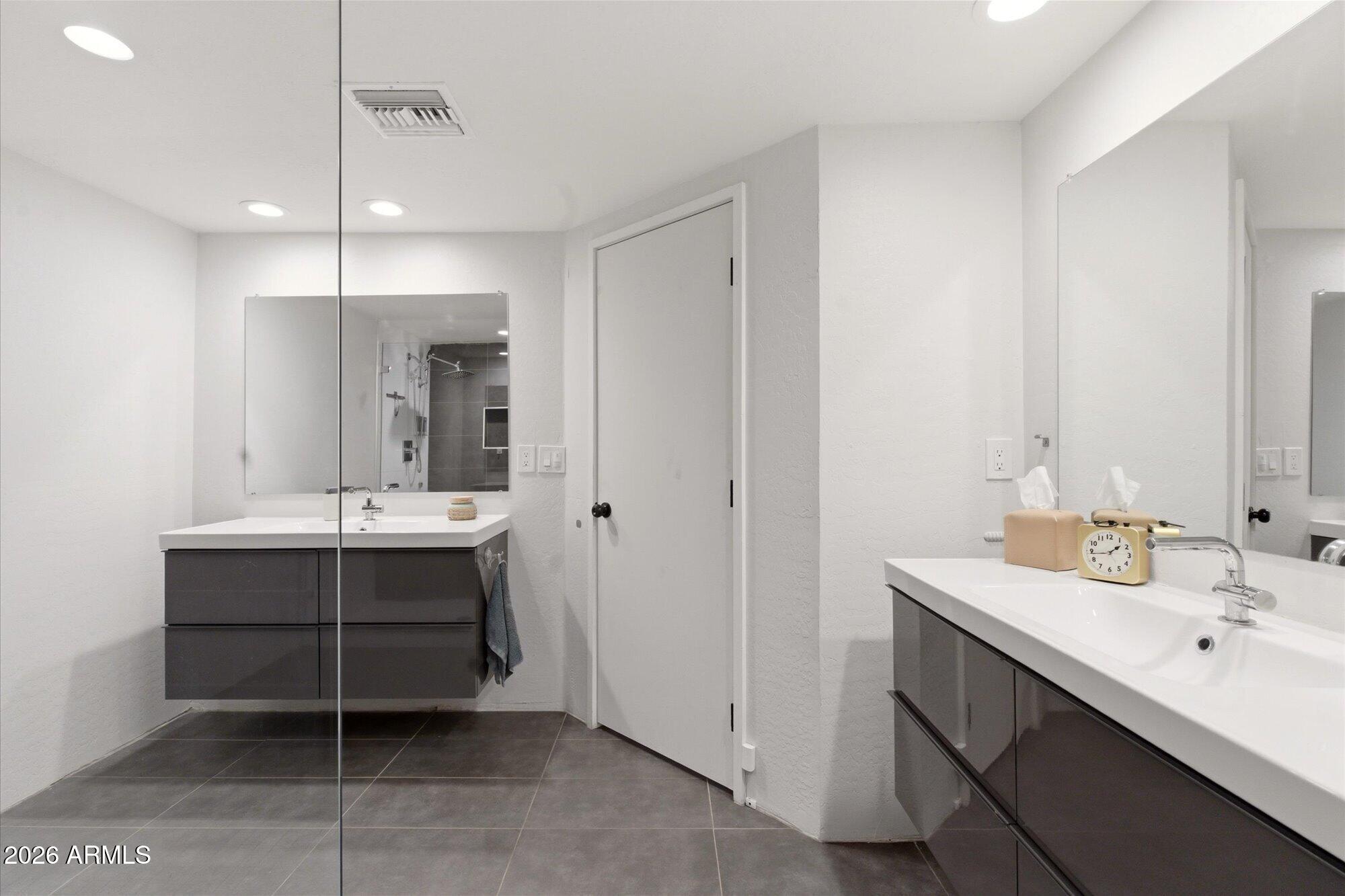 3020 East Wethersfield Road Phoenix, AZ 85032 - Photo 22 of 46 a bathroom with a sink double vanity and a mirror