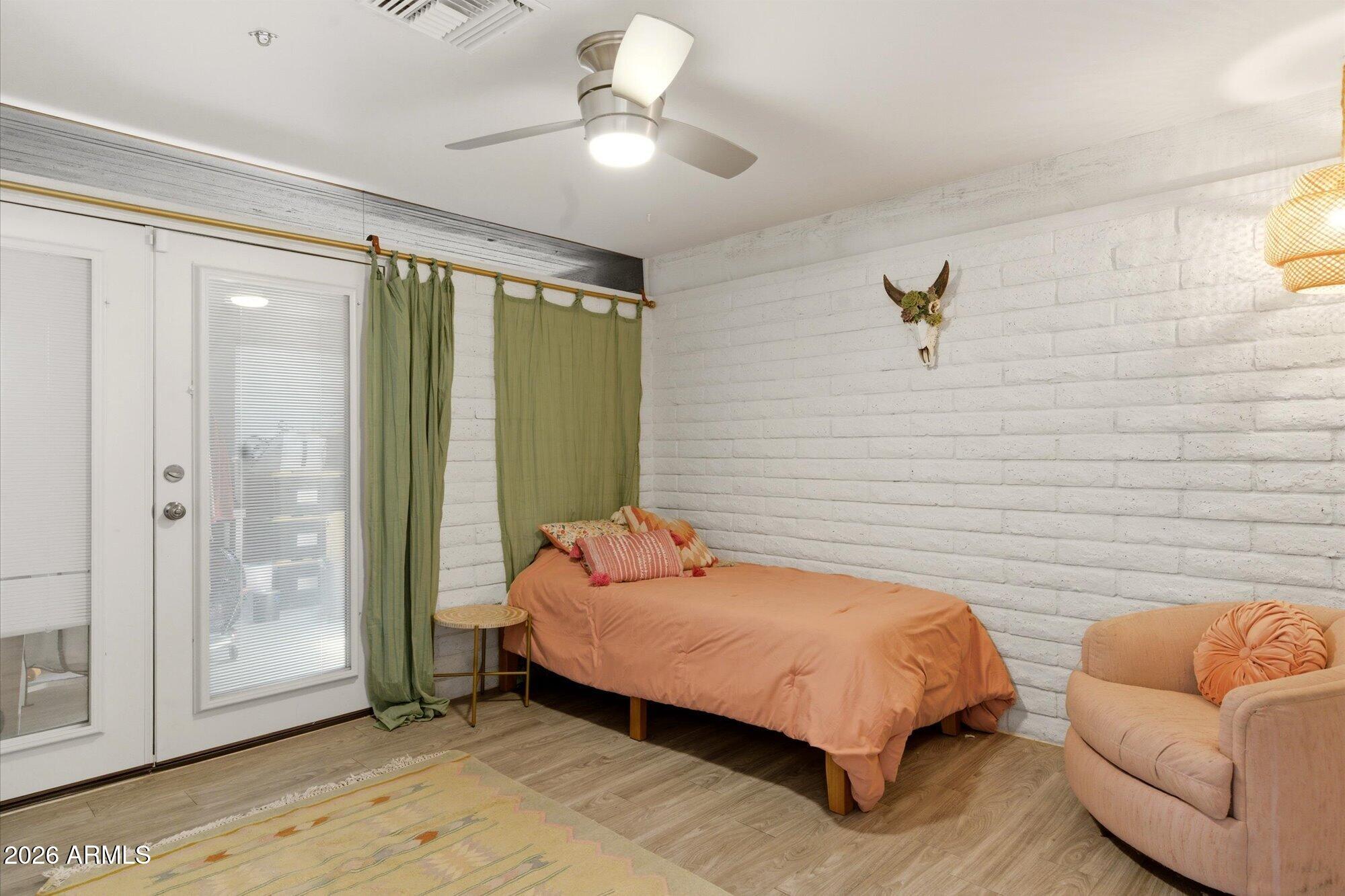 3020 East Wethersfield Road Phoenix, AZ 85032 - Photo 30 of 46 a bedroom with a bed and a couch