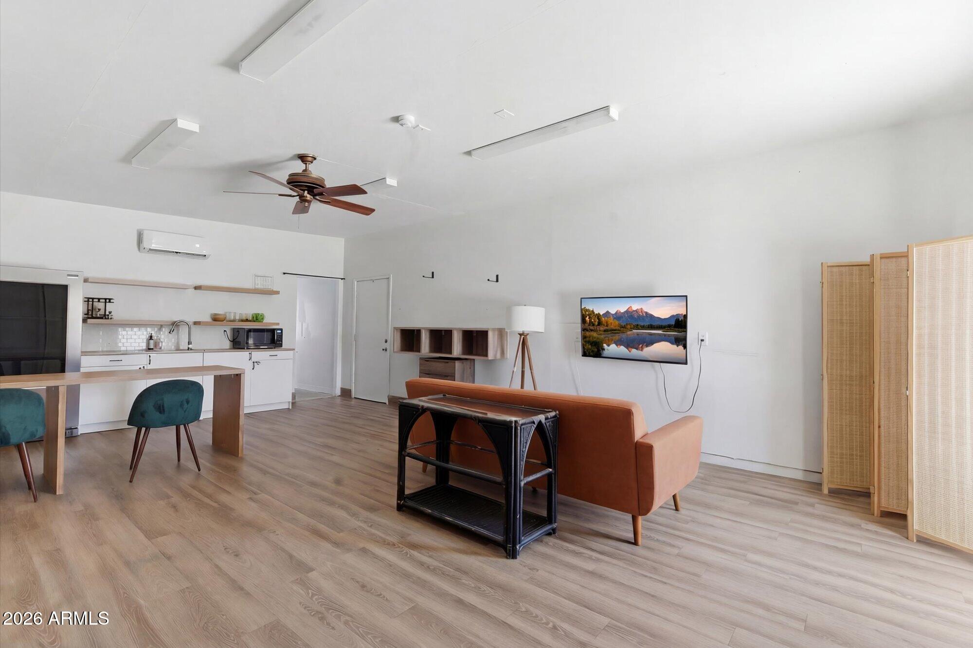3020 East Wethersfield Road Phoenix, AZ 85032 - Photo 32 of 46 a living room with furniture and a fireplace