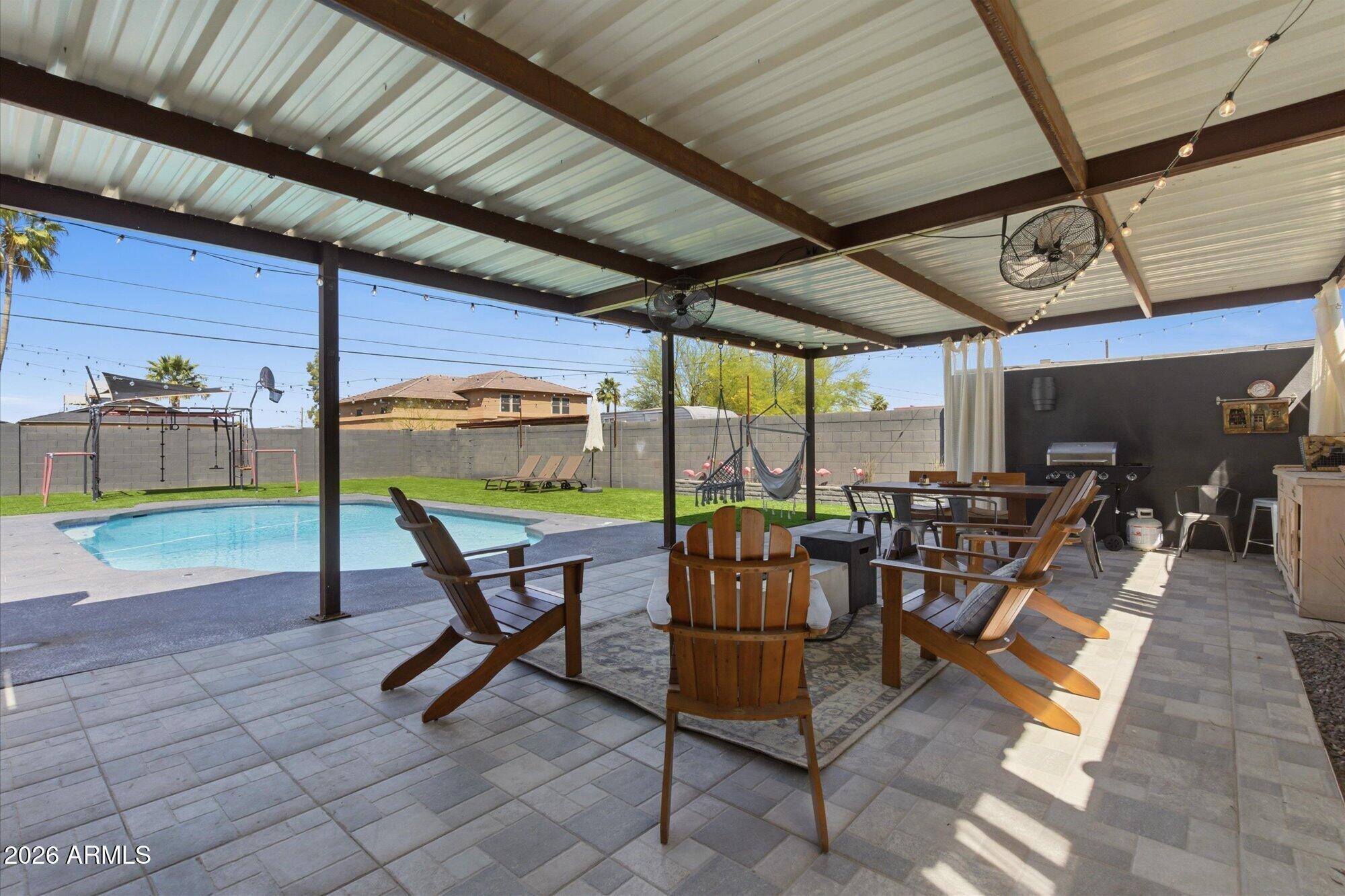 3020 East Wethersfield Road Phoenix, AZ 85032 - Photo 38 of 46 a view of a chairs and table in a patio
