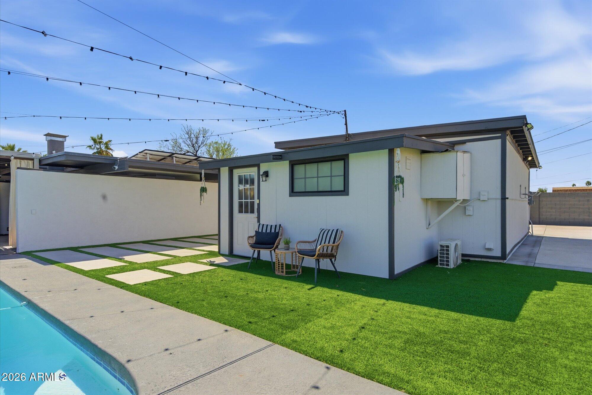 3020 East Wethersfield Road Phoenix, AZ 85032 - Photo 5 of 46 a view of a backyard with plants and a patio